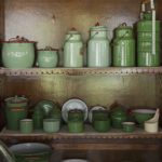 A variety of green toned heritage tableware on display shelves at The Bangala Hotel in Chettinad, Tamil Nadu.