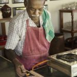 Master Chef Karrupiah of The Bangala Hotel and cooking school in Karaikudi at work on a mutton recipe.