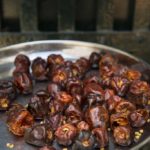 Ruby red dried goondu milagai chilies rest on a silver serving platter, The Bangala Hotel, Chettinad, India.