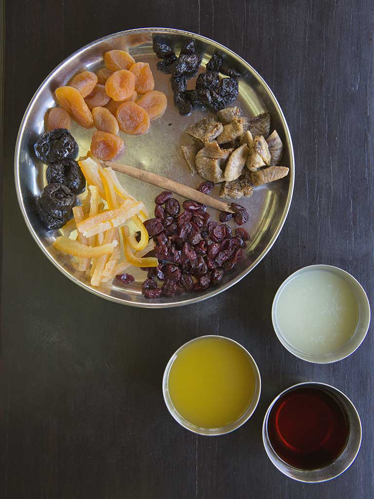 Mis-en-place for fruit compote - apricots, dates, prunes, cranberries, candied orange peel, cinnamon stick, orange juice, lime juice, rum. The Bangala, Karaikudi, Chettinad.