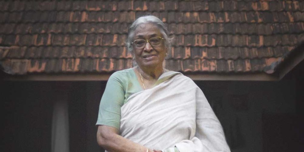 A portrait of Mrs. Meenakshi Meyyappan, proprietor of The Bangala Hotel, in the courtyard of her Karaikudi home.