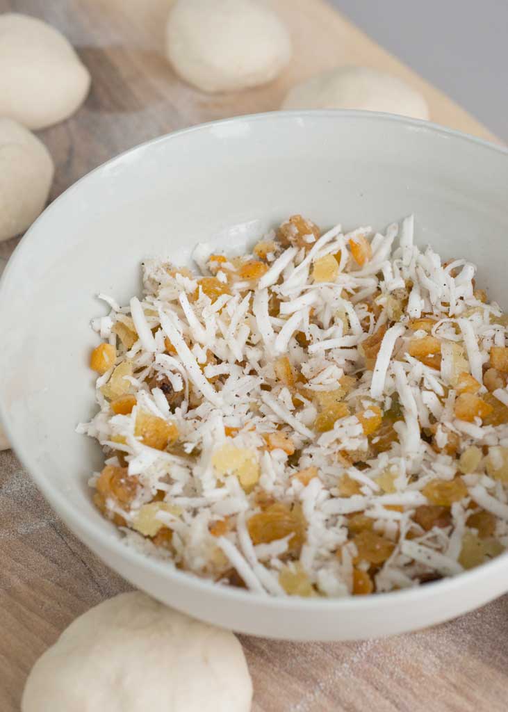 Shredded coconut, candied ginger and citrus peel filling for buns.