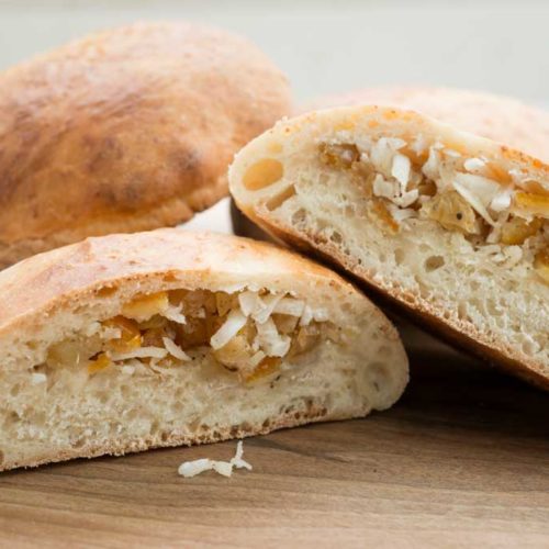 Coconut buns with candied ginger and citrus peel.