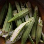 Fresh green okra sliced lengthwise