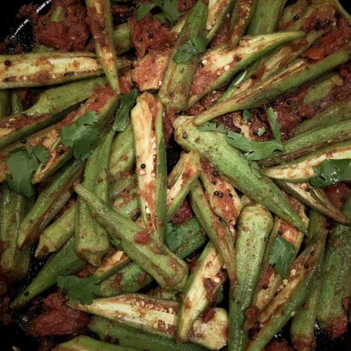 Okra sliced lengthwise is prepared into a red curry.