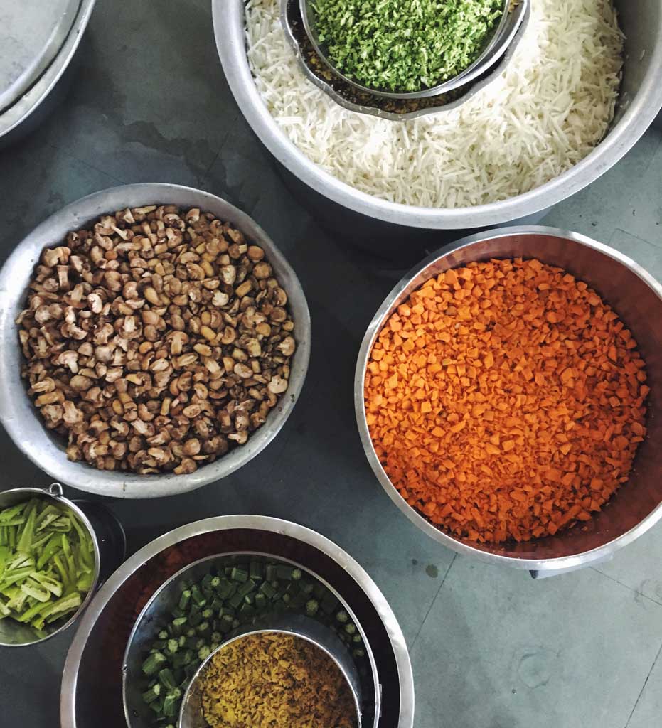 Vegetable preparation at the Akshaya at Isha Yoga Center in Coimbatore, Tamil Nadu, India