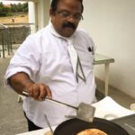 Chef Dhiraj flipping utappam