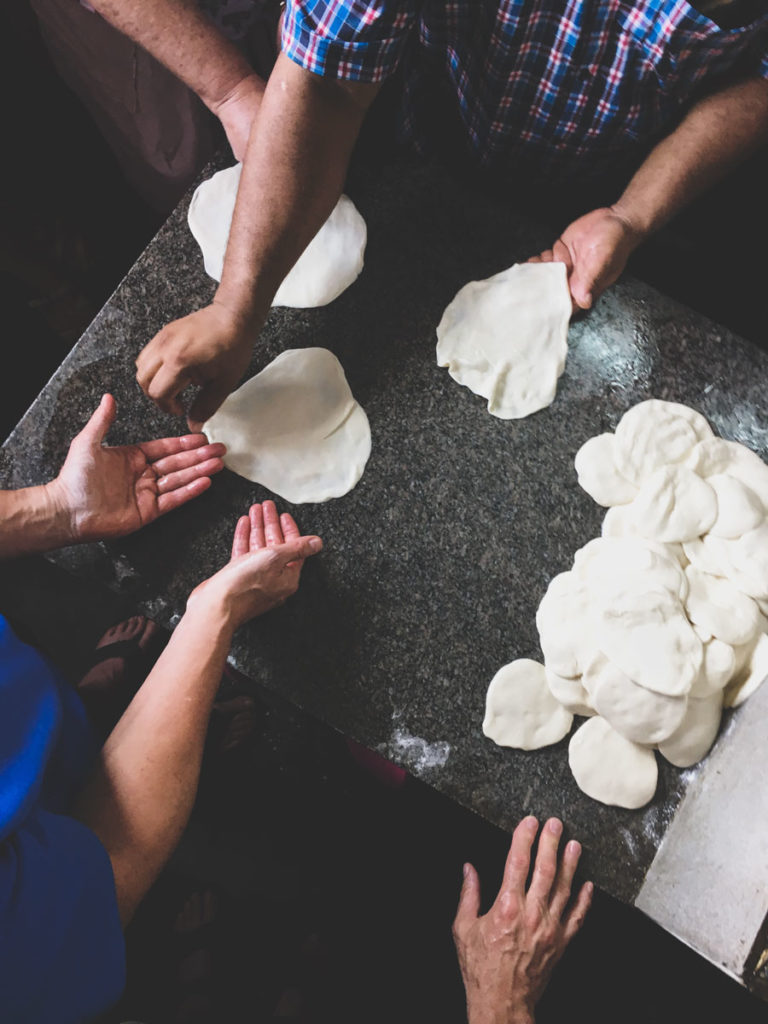 Paratha stretching at Thekkady Barbeque Cooking School.