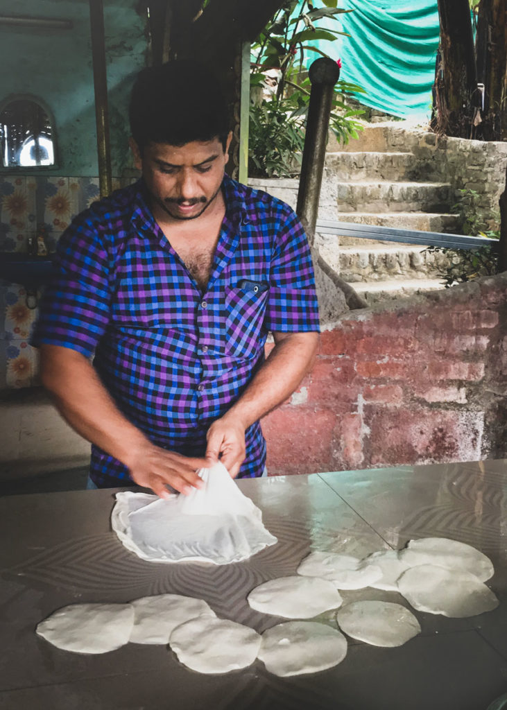 Sheril in the kitchen of his Thekkady cooking school preparing paratha.