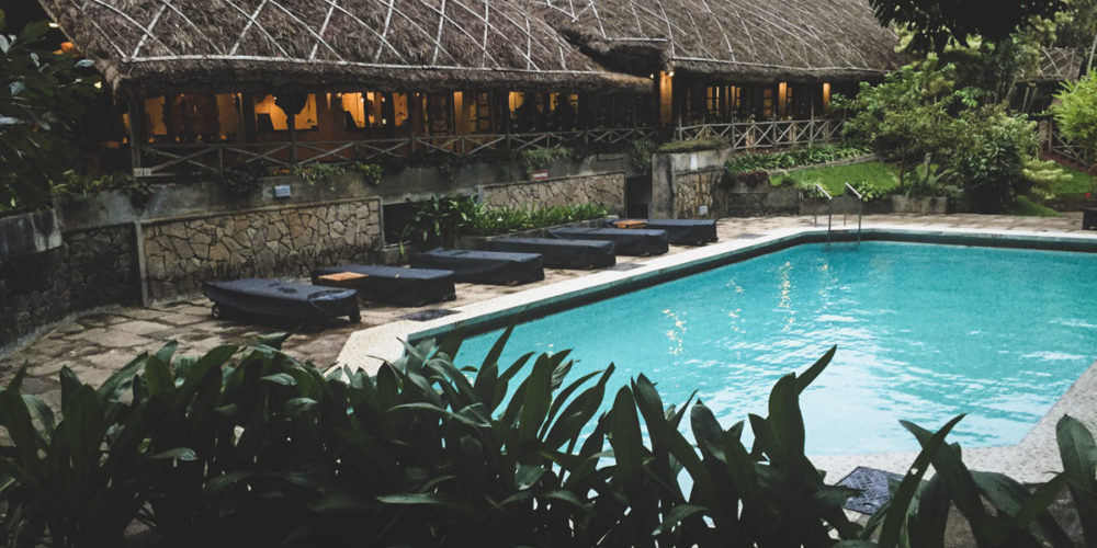 Poolside at CGH Earth's Spice Village.