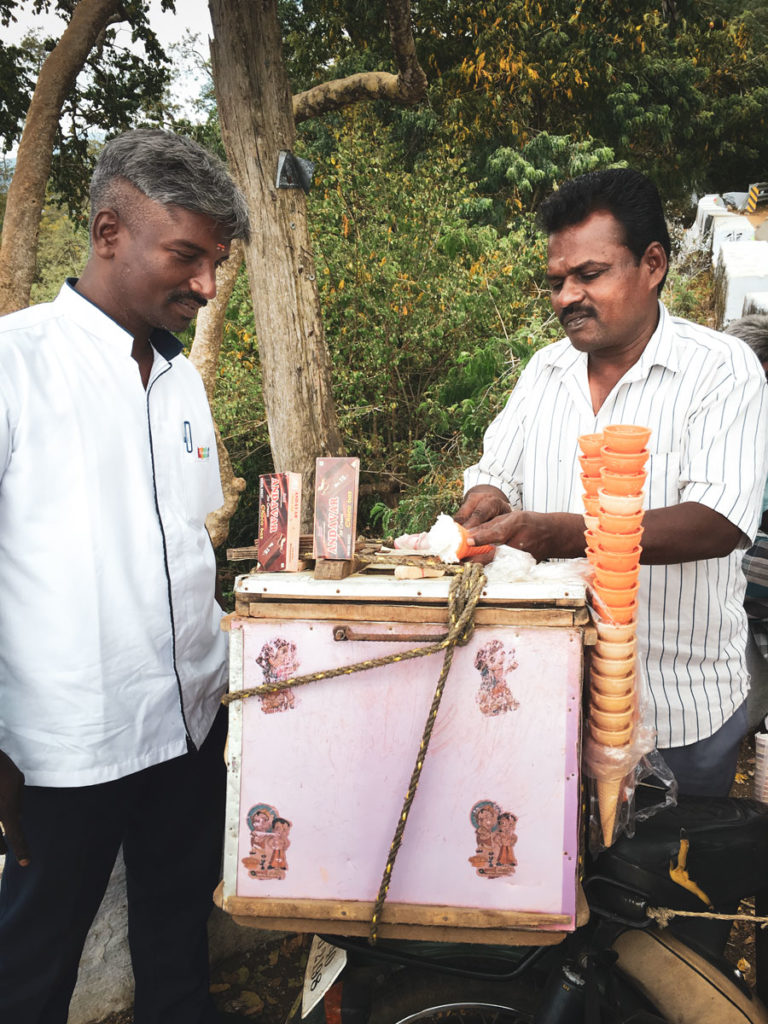 Muraly on assignment testing ice cream sold by a small vendor on a roadside in South India.