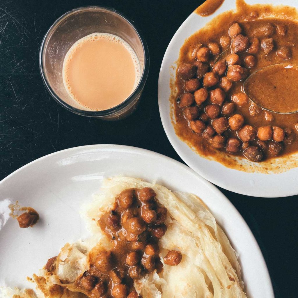 Kadala curry, flaky paratha, and creamy cardamom-scented chai