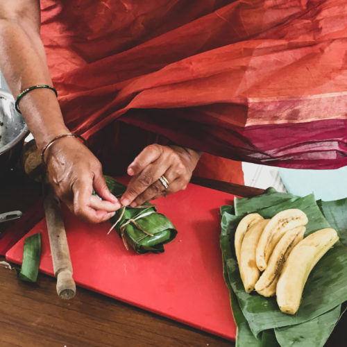 The banana and stick rice packets are tied with twine.