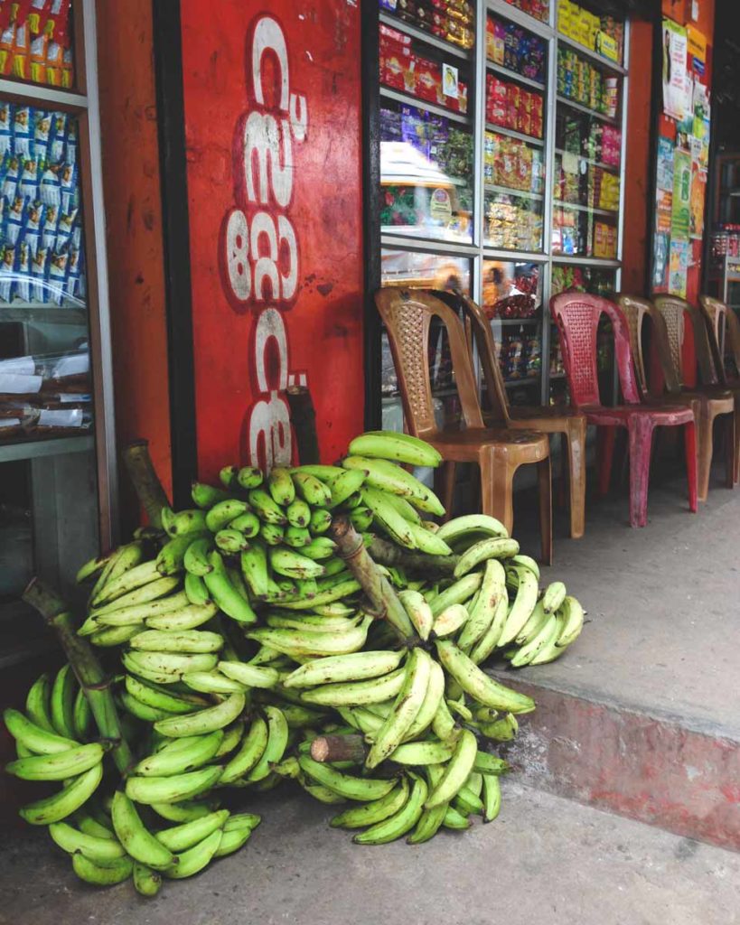 banana bunches at a store front