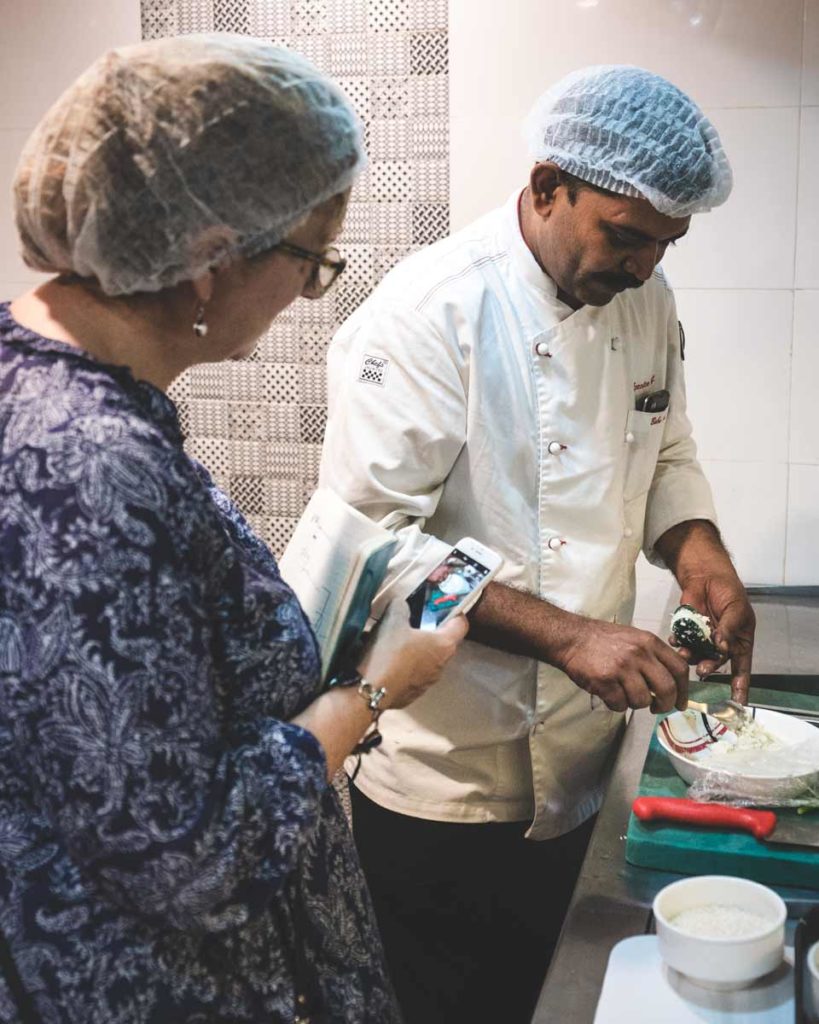 Chef prepares Arikkadukka in the kitchen