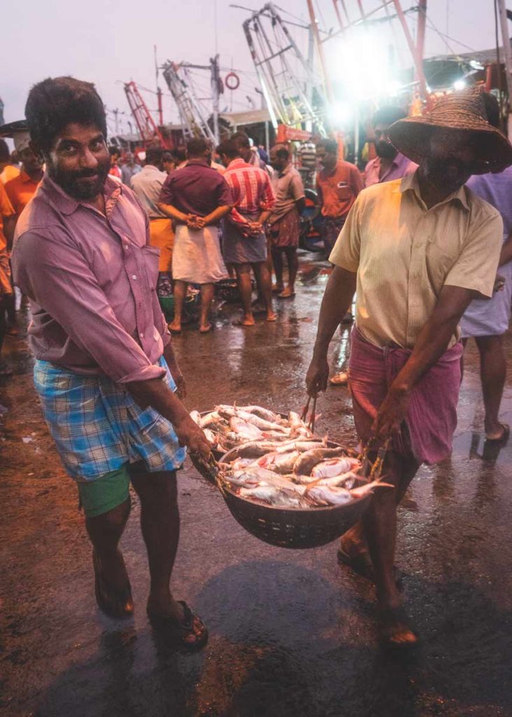 Kozhikode-Fish-Auction-Men-with-Basket-of-Fish