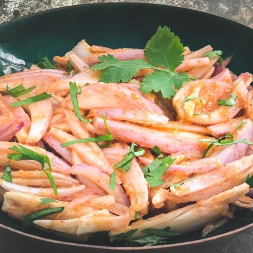 A bowl of shallot salad