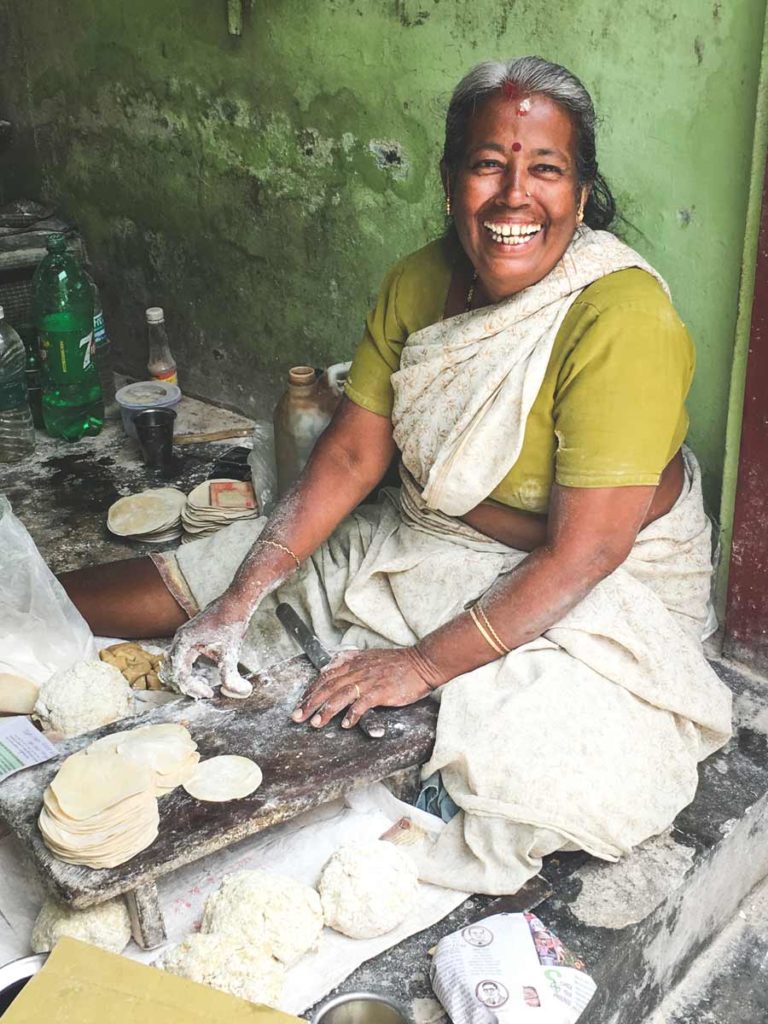 Papadam maker smiling