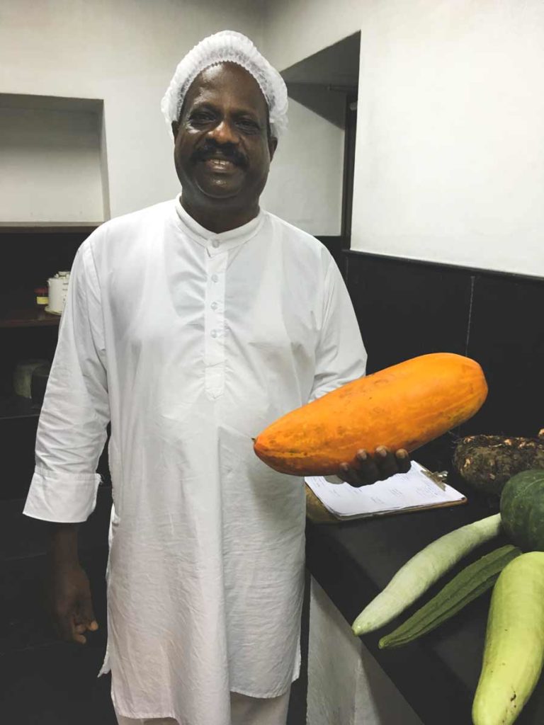 Chef with large orange gourd