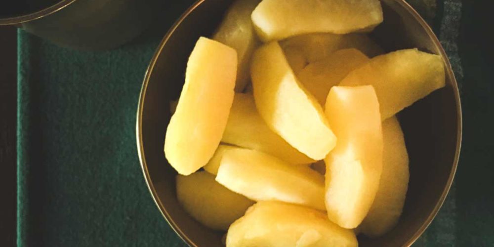 Steamed apple segments in a bowl