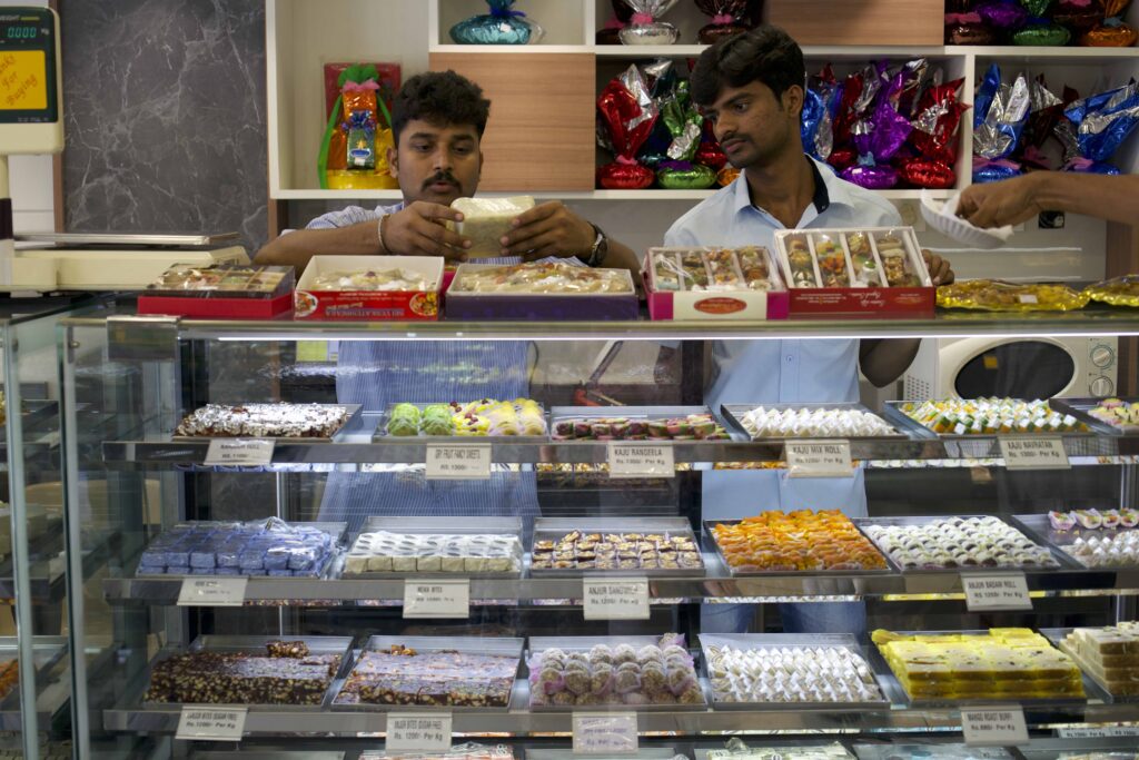 two men selling sweets