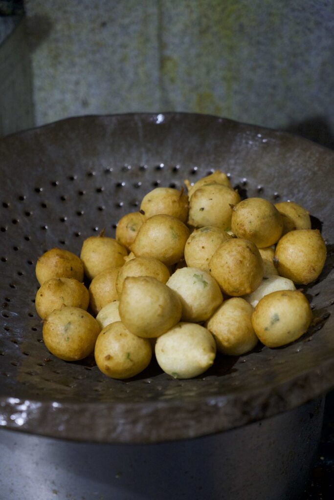 round fritters on a strainer