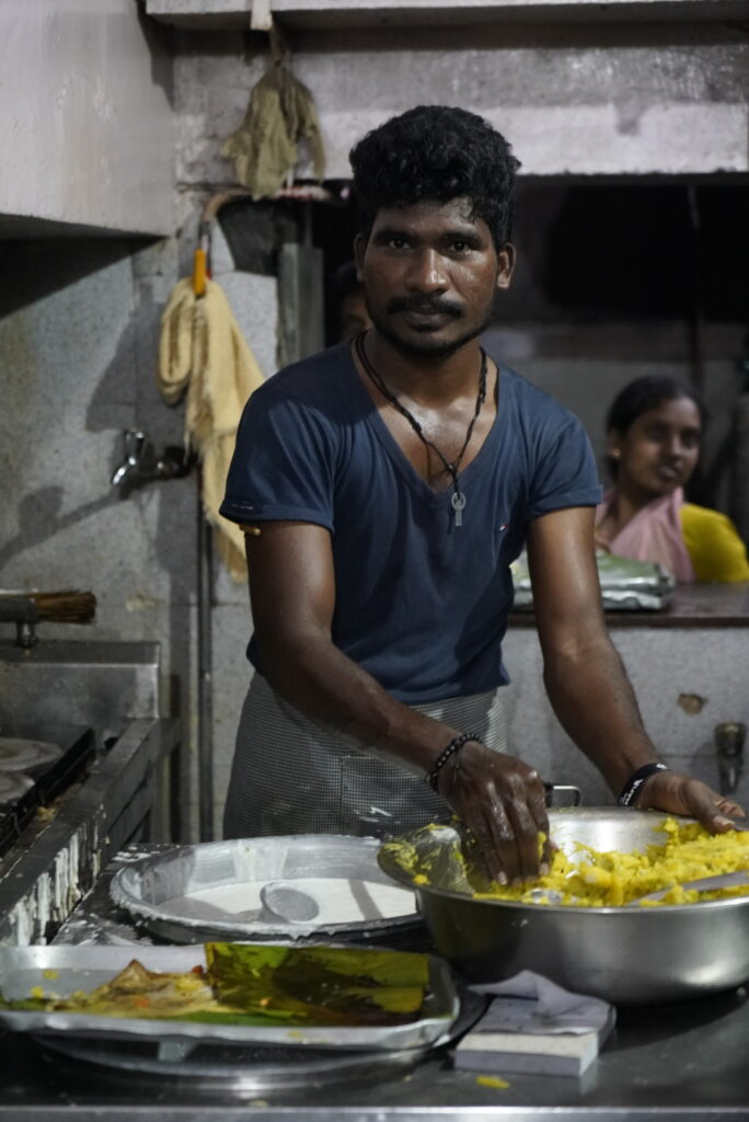 an indian man cooking