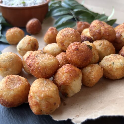 fried balls of dough on brown paper