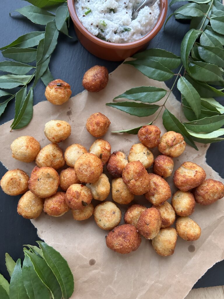 fried balls of dough on brown paper