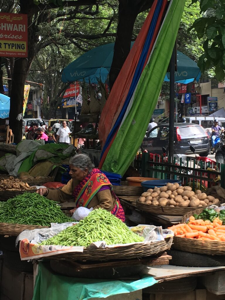 woman surrounded by market produce