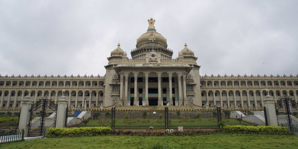 large marble building behind gates