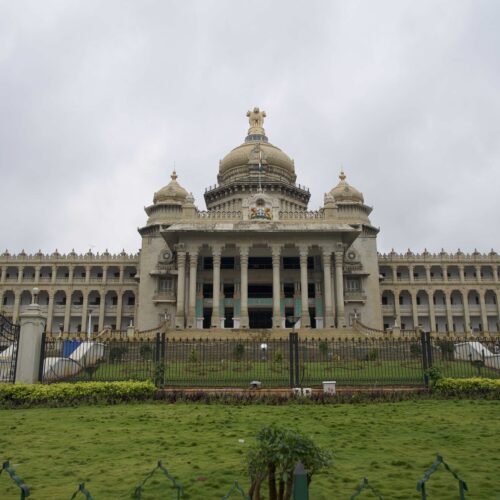 large marble building behind gates