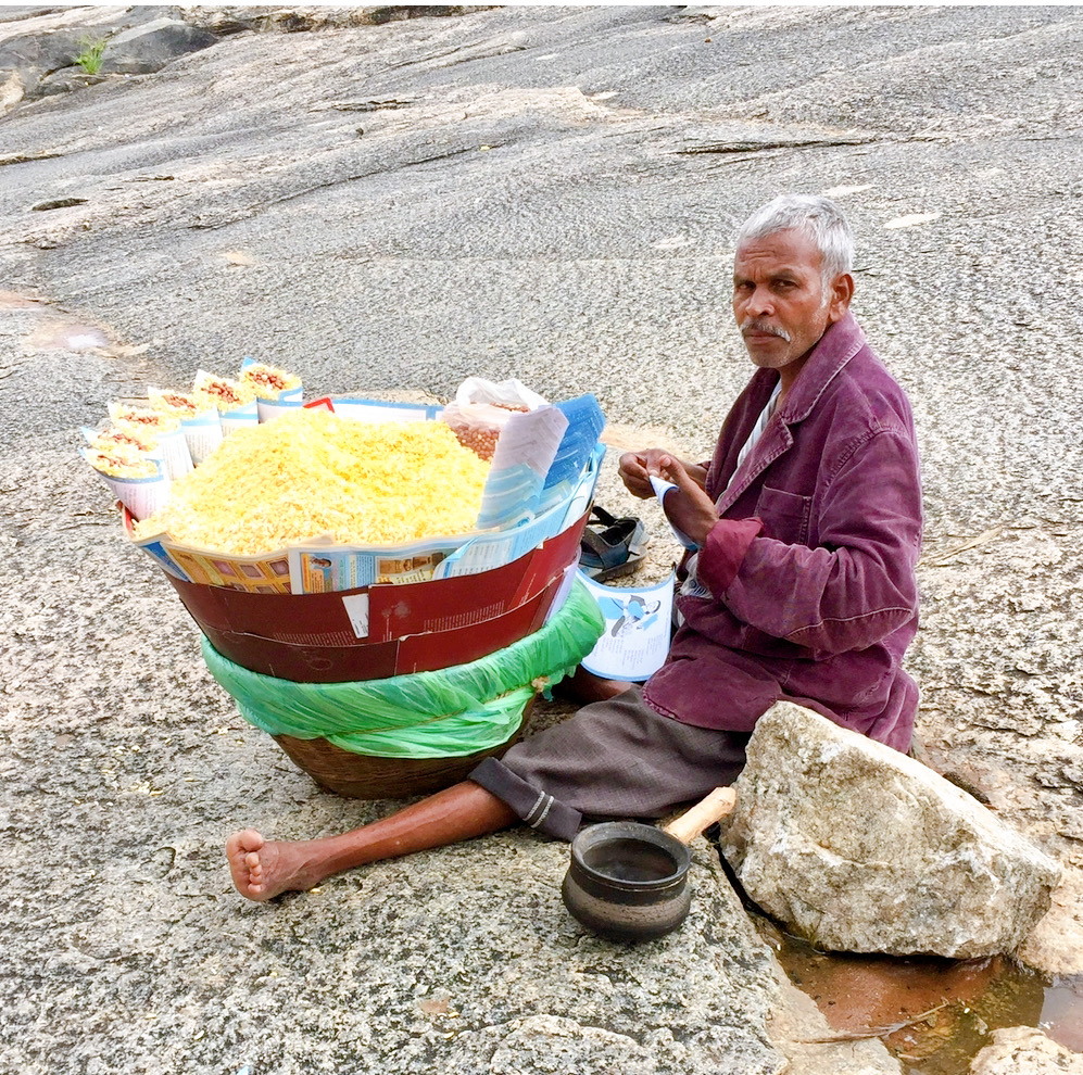 close up of man selling peanuts