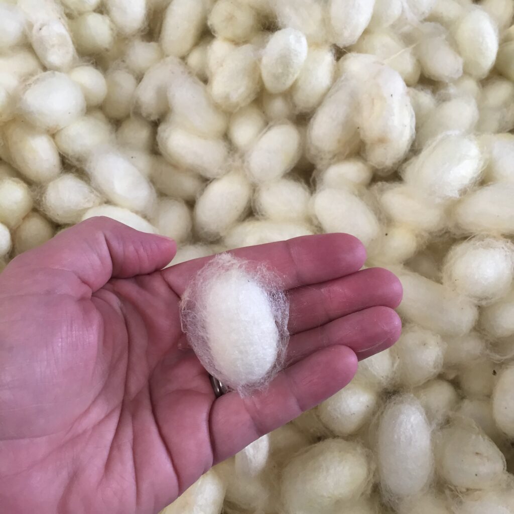 a fluffy ball of wool or silk