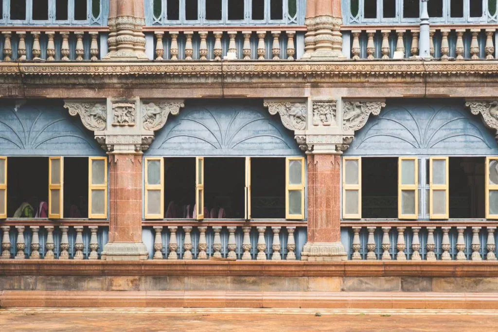 Mysore palace exterior with blue and beige trip